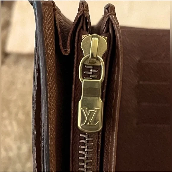 LOUIS VUITTONPortefeuille Alexandre Trifold Wallet w/ Dust Bag.